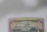 В одном из банков Череповца нашли фальшивые доллары